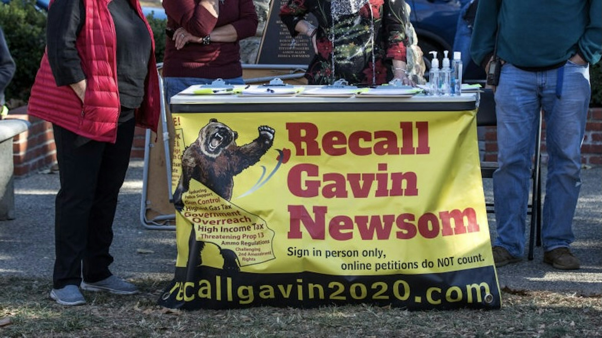 SOLVANG, CA - DECEMBER 20: People circulating a "Recall Gavin Newsom" petition listen to speakers decry a stolen election and demand the state open all businesses during an unsanctioned "Solvang MAGA Protest" in the park on December 20, 2020 in Solvang, California. Despite the rapidly rising surge of cases and deaths in California following Thanksgiving, tourists, primarily from Southern California and Los Angeles continue to be drawn to this Danish-themed Central Coast community each weekend. (Photo by George Rose/Getty Images)