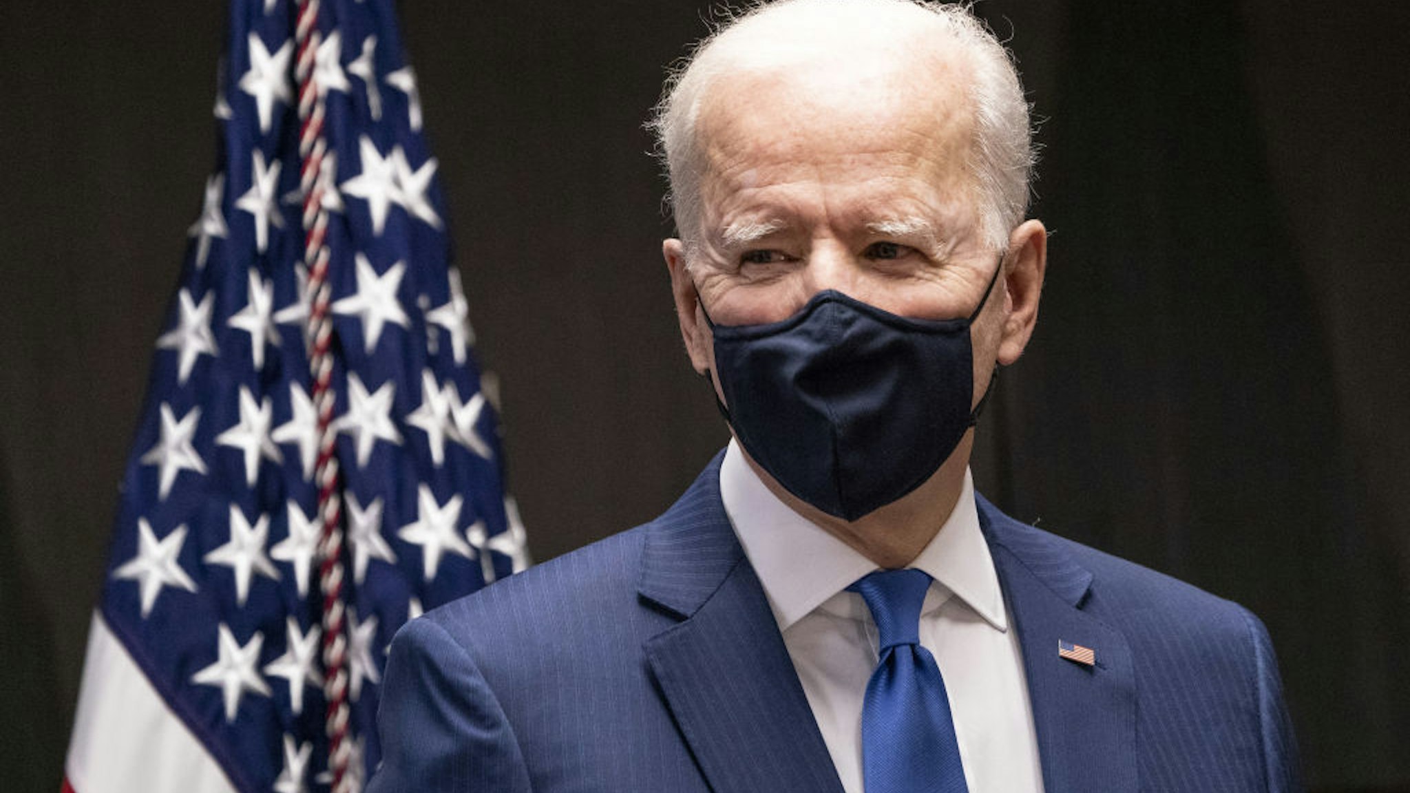 U.S. President Joe Biden speaks during a visit to a Veterans Affairs medical center Covid-19 vaccine site in Washington, D.C., U.S., on Monday, March 8, 2021. Vaccinated people can visit indoors without masks, but must still wear them in public and avoid large gatherings when around those who aren't immunized or are at high risk for contracting Covid-19, the CDC said today.