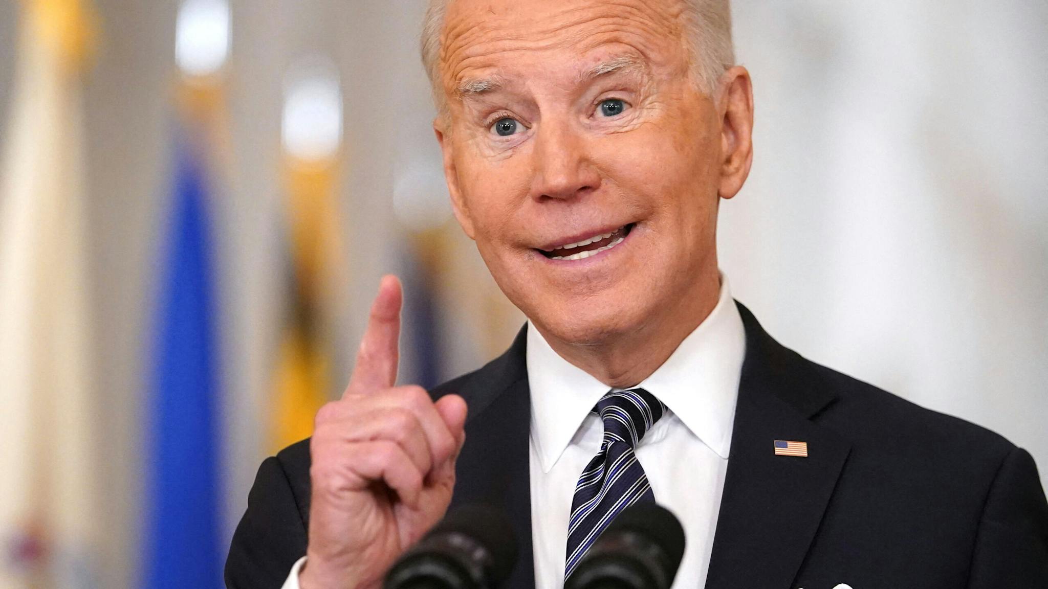 US-POLITICS-BIDEN-HEALTH-COVID-ANNIVERSARY US President Joe Biden gestures as he speaks on the anniversary of the start of the Covid-19 pandemic, in the East Room of the White House in Washington, DC on March 11, 2021.