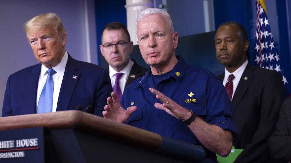 President Trump And Members Of The Coronavirus Task Force Hold Press Briefing Brett Giroir, U.S. assistant secretary for health, center, speaks during a Coronavirus Task Force news conference in the briefing room of the White House in Washington, D.C., U.S., on Saturday, March 21, 2020. President Donald Trump said negotiators in Congress and his administration are "very close" to agreement on a coronavirus economic-relief plan that his economic adviser said will aim to boost the U.S. economy by about $2 trillion.