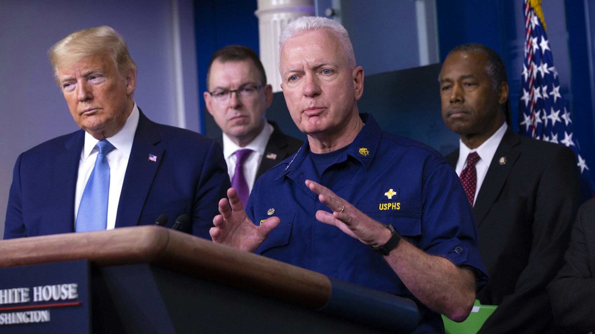 Brett Giroir, U.S. assistant secretary for health, center, speaks during a Coronavirus Task Force news conference in the briefing room of the White House in Washington, D.C., U.S., on Saturday, March 21, 2020. President Donald Trump said negotiators in Congress and his administration are "very close" to agreement on a coronavirus economic-relief plan that his economic adviser said will aim to boost the U.S. economy by about $2 trillion.