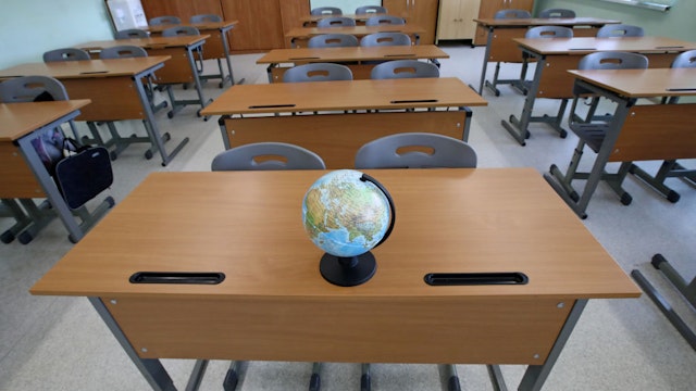 MOSCOW, RUSSIA - MAY 23, 2020: A globe in an empty classroom at No 2127 Comprehensive School during the pandemic of the novel coronavirus disease (COVID-19). Sergei Karpukhin/TASS