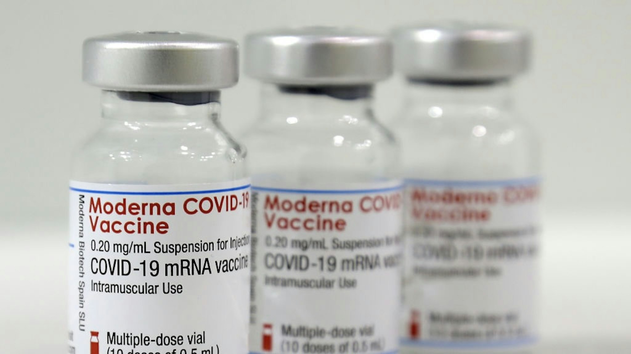 BERLIN, GERMANY - FEBRUARY 17: Three vials of the 'Moderna COVID-19 Vaccine' are pictured at a new coronavirus, COVID-19, vaccination center at the 'Velodrom' (velodrome-stadium) on February 17, 2021 in Berlin, Germany. (Photo by Michael Sohn - Pool/Getty Images)