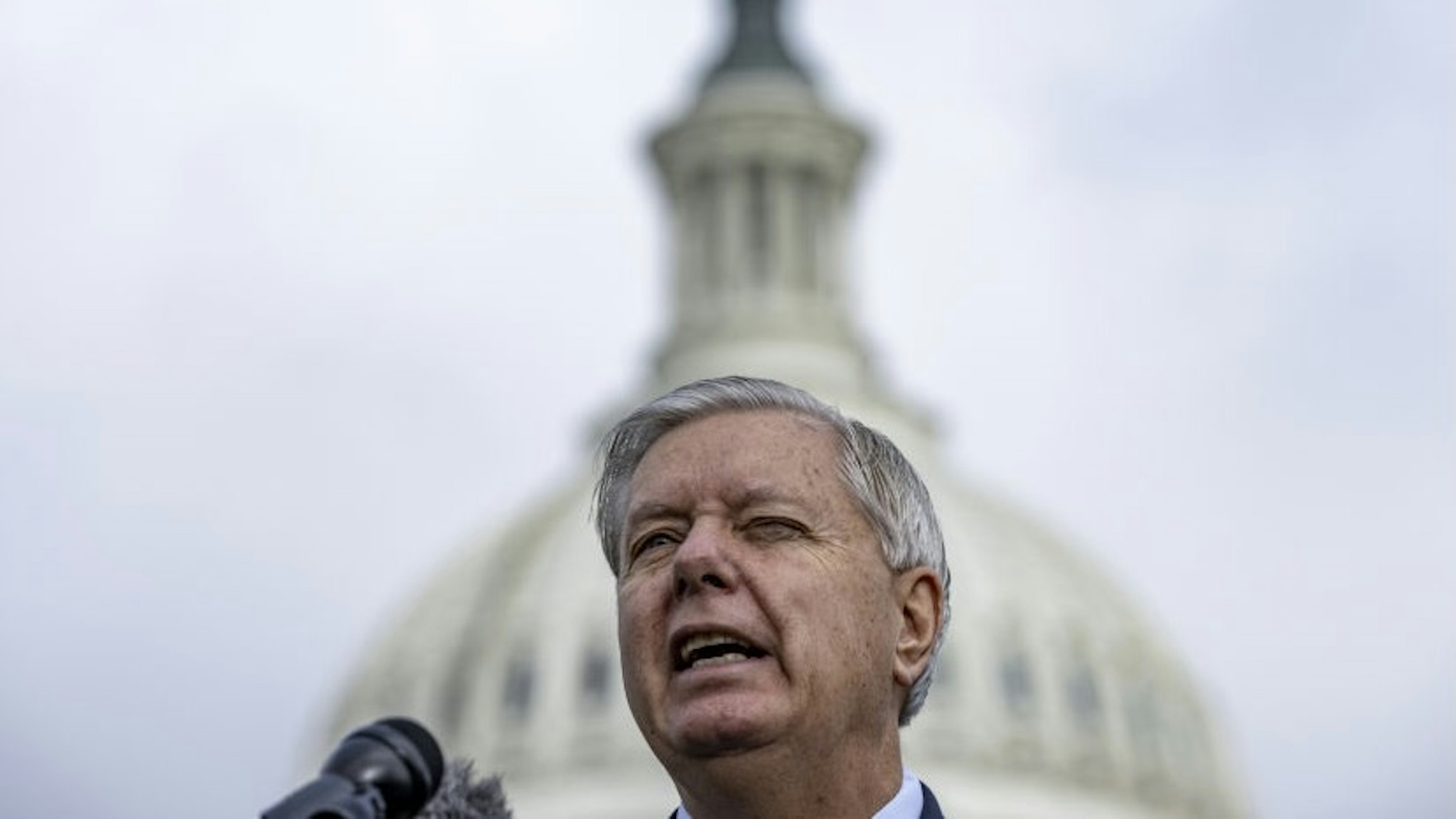 Senator Lindsey Graham, a republican from North Carolina, speaks during a news conference on immigration reform in Washington, D.C., U.S., on Wednesday, March 17, 2021. President Biden's next major economic package will almost certainly have to rely once again on a Democrat-only approach after Senate Minority Leader McConnell shut the door on Republican support for tax hikes to pay for it. Photographer: Samuel Corum/Bloomberg