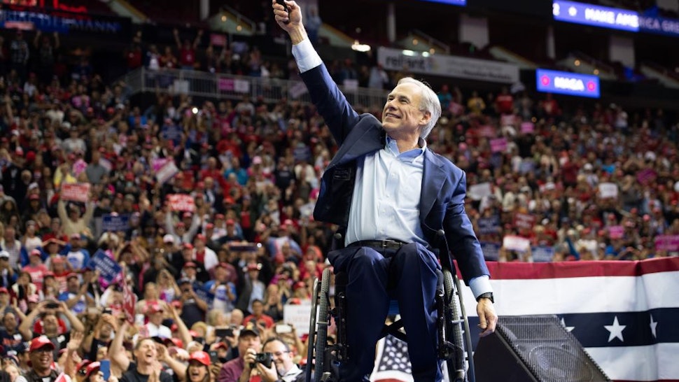 Texas Republican Governor Greg Abbott speaks during a campaign rally by US President Donald Trump at the Toyota Center in Houston, Texas, October 22, 2018.