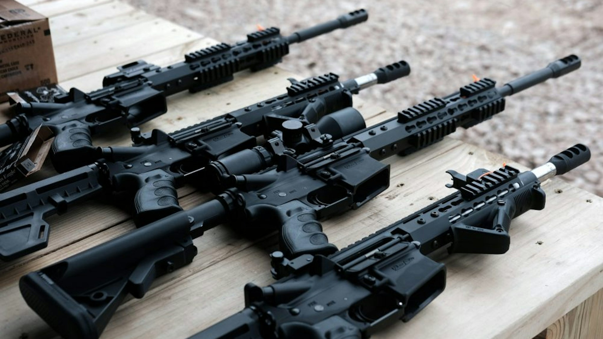 GREELEY, PENNSYLVANIA - OCTOBER 12: AR-15 rifles and other weapons are displayed on a table at a shooting range during the “Rod of Iron Freedom Festival” on October 12, 2019 in Greeley, Pennsylvania. The two-day event, which is organized by Kahr Arms/Tommy Gun Warehouse and Rod of Iron Ministries, has billed itself as a “second amendment rally and celebration of freedom, faith and family.” Numerous speakers, vendors and displays celebrated guns and gun culture in America.