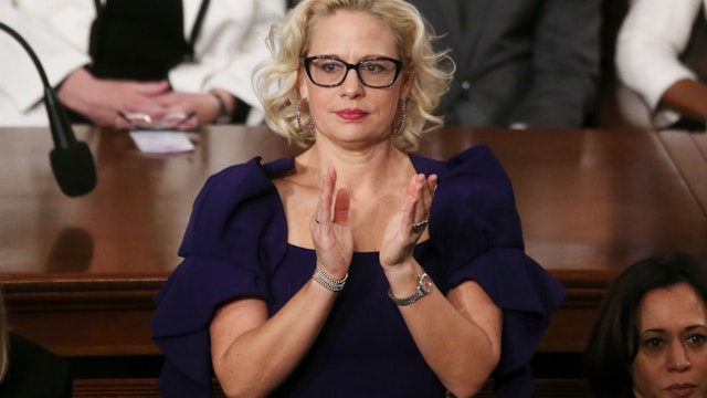 Sen. Krysten Sinema (D-AZ) applauds during the State of the Union address in the chamber of the U.S. House of Representatives on February 04, 2020 in Washington, DC.