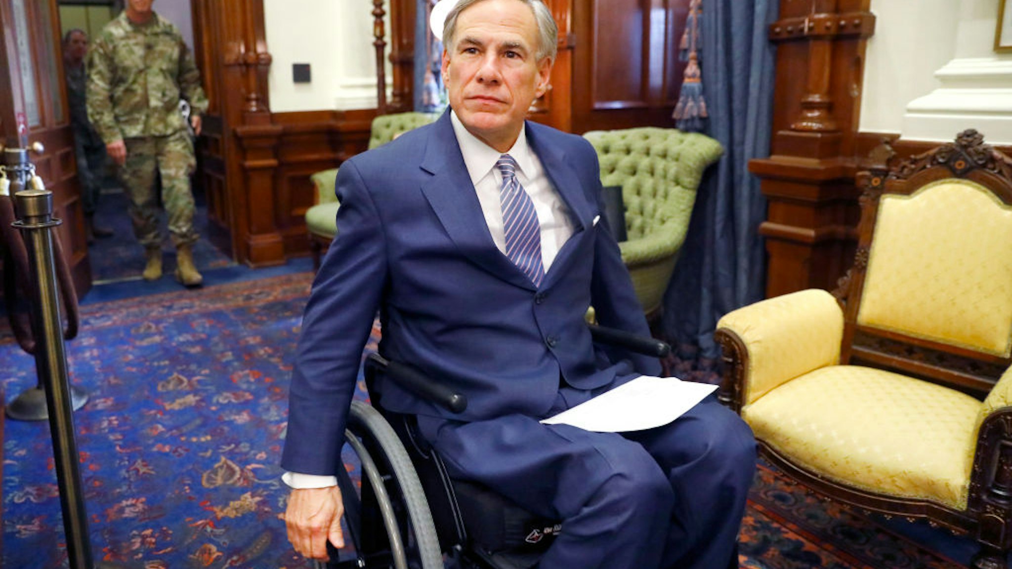 Texas Governor Greg Abbott arrives for his COVID-19 press conference at the Texas State Capitol in Austin.