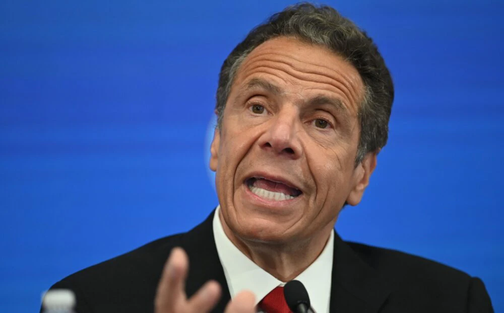 Governor of New York Andrew Cuomo speaks during a press conference at the New York Stock Exchange (NYSE) on May 26, 2020 at Wall Street in New York City. - The New York Stock Exchange, the symbolic heart of Wall Street, reopened its floor Tuesday after a two-month closure due to the coronavirus, with traders donning masks and separated by plexiglas.Stocks surged at the outset of the session following the trademark opening bell, which was presided by New York Governor Andrew Cuomo and NYSE officials -- all donning masks.