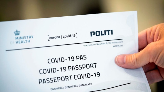 Picture taken on July 10, 2020 shows a Covid-19 passport printed from a website in Copenhagen, on July 10, 2020. - With the new Covid-19 passport issued be the Danish authorities, Danes now have official documentation for testing on their travels abroad. (Photo by Ida Marie Odgaard / Ritzau Scanpix / AFP) / Denmark OUT (Photo by IDA MARIE ODGAARD/Ritzau Scanpix/AFP via Getty Images)