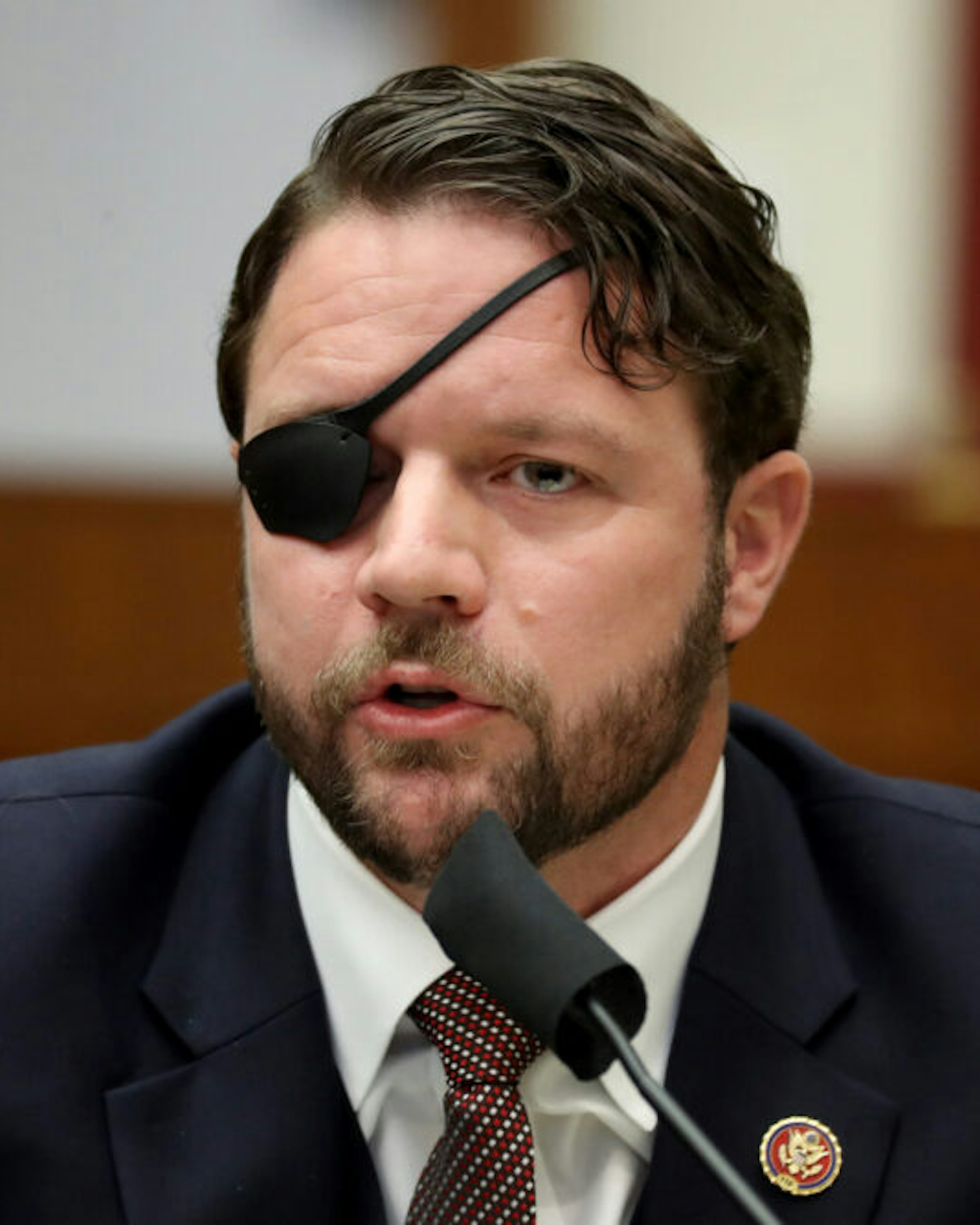Representative Dan Crenshaw, a Republican from Texas, speaks during a House Homeland Security Committee security hearing in Washington, D.C., U.S., on Thursday, Sept. 17, 2020. The hearing focused on international terrorism threats, the rise in domestic terrorism incidents and recent shootings as well as election security and cyber threats.