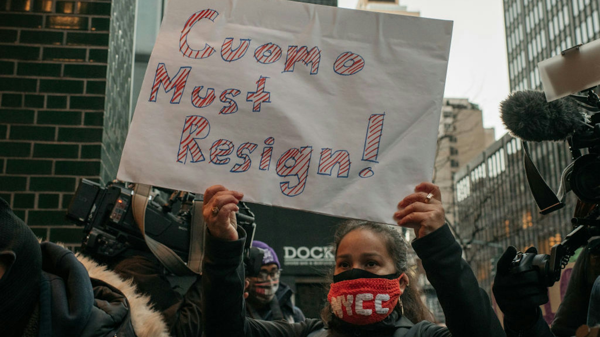 Demonstrators call on New York Gov. Andrew Cuomo to resign at a rally on March 2, 2021 in New York City.