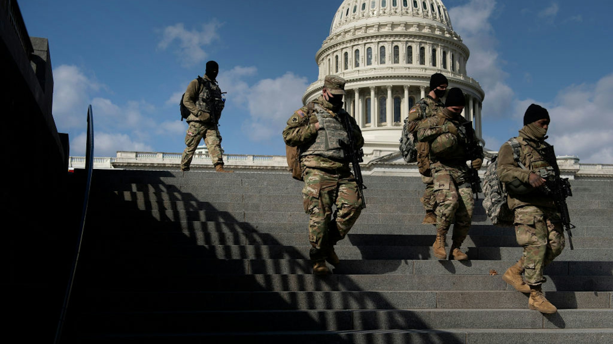 Members of the National Guard patrol the grounds of the US Capitol on March 4, 2021, in Washington, DC. - Lawmakers and staff were advised to stay away from the US Capitol after the FBI and Homeland Security Department warned that violent militia groups and QAnon followers had discussed attacking the legislature on or about March 4. The FBI-Homeland Security bulletin said extremists are still motivated by unfounded Republican claims of widespread voter fraud in the November presidential election won by Democrat Joe Biden. (Photo by Brendan Smialowski / AFP) (Photo by BRENDAN SMIALOWSKI/AFP via Getty Images)