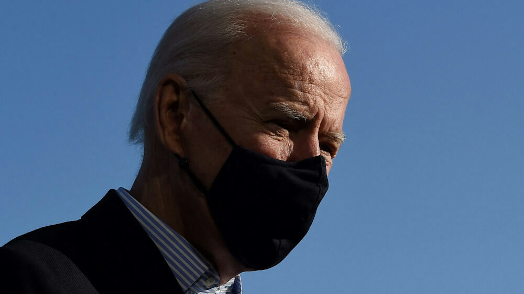 US President Joe Biden talks briefly with reporters upon his return from Camp David, Maryland to the White House in Washington, DC on March 21, 2021.