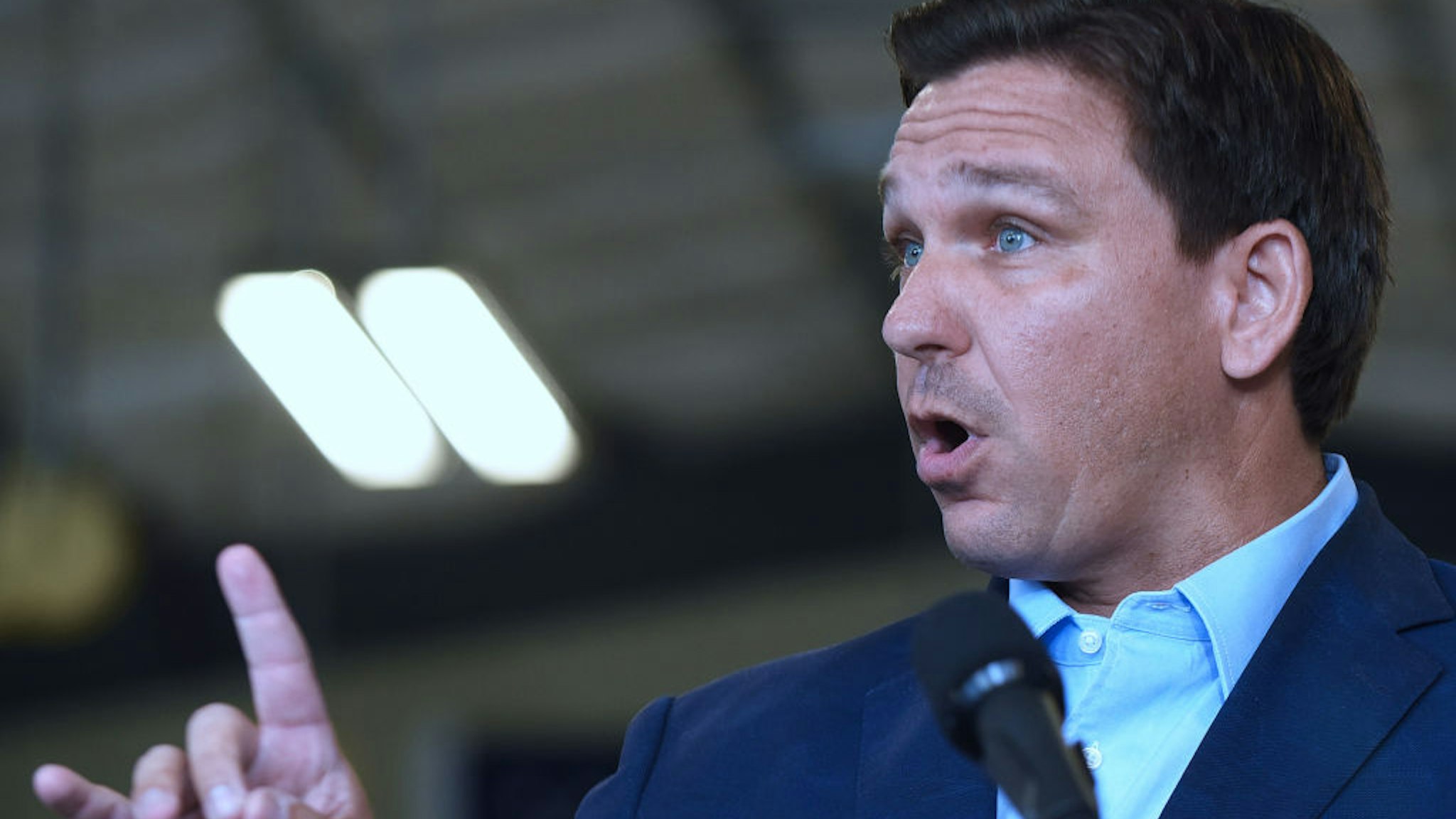 Florida Governor, Ron DeSantis responds to a question from the media at a press conference at the Eau Gallie High School aviation hangar.