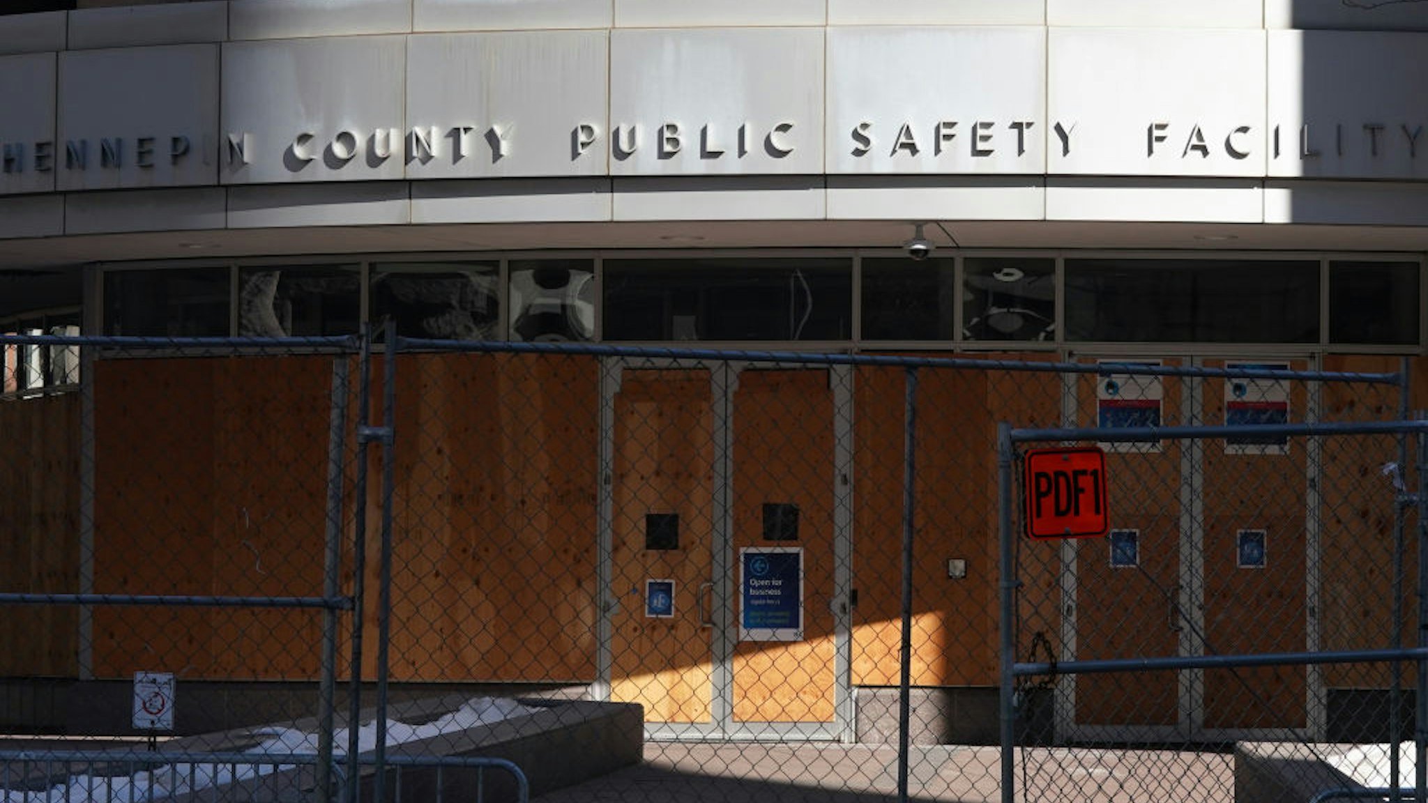 Chain link fence with barbed wire, concrete barriers, and concertina wire surrounded the Hennepin County Public Safety Facility, the Hennepin County Government Center and City Hall as crews worked to fortify the buildings in preparation for Derek Chauvin"u2019s trial in the killing of George Floyd.