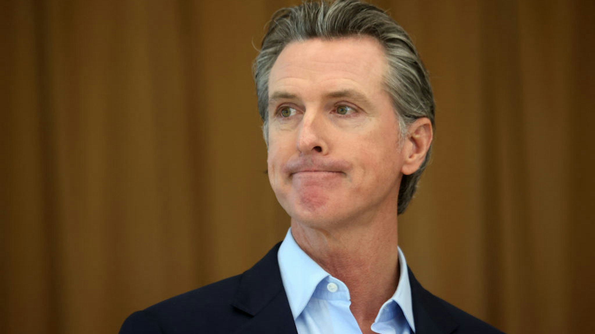 ALAMEDA, CALIFORNIA - MARCH 16: California Gov. Gavin Newsom looks on during a news conference after he toured the newly reopened Ruby Bridges Elementary School on March 16, 2021 in Alameda, California. Gov. Newsom is traveling throughout California to highlight the state's efforts to reopen schools and businesses as he faces the threat of recall. (Photo by Justin Sullivan/Getty Images)