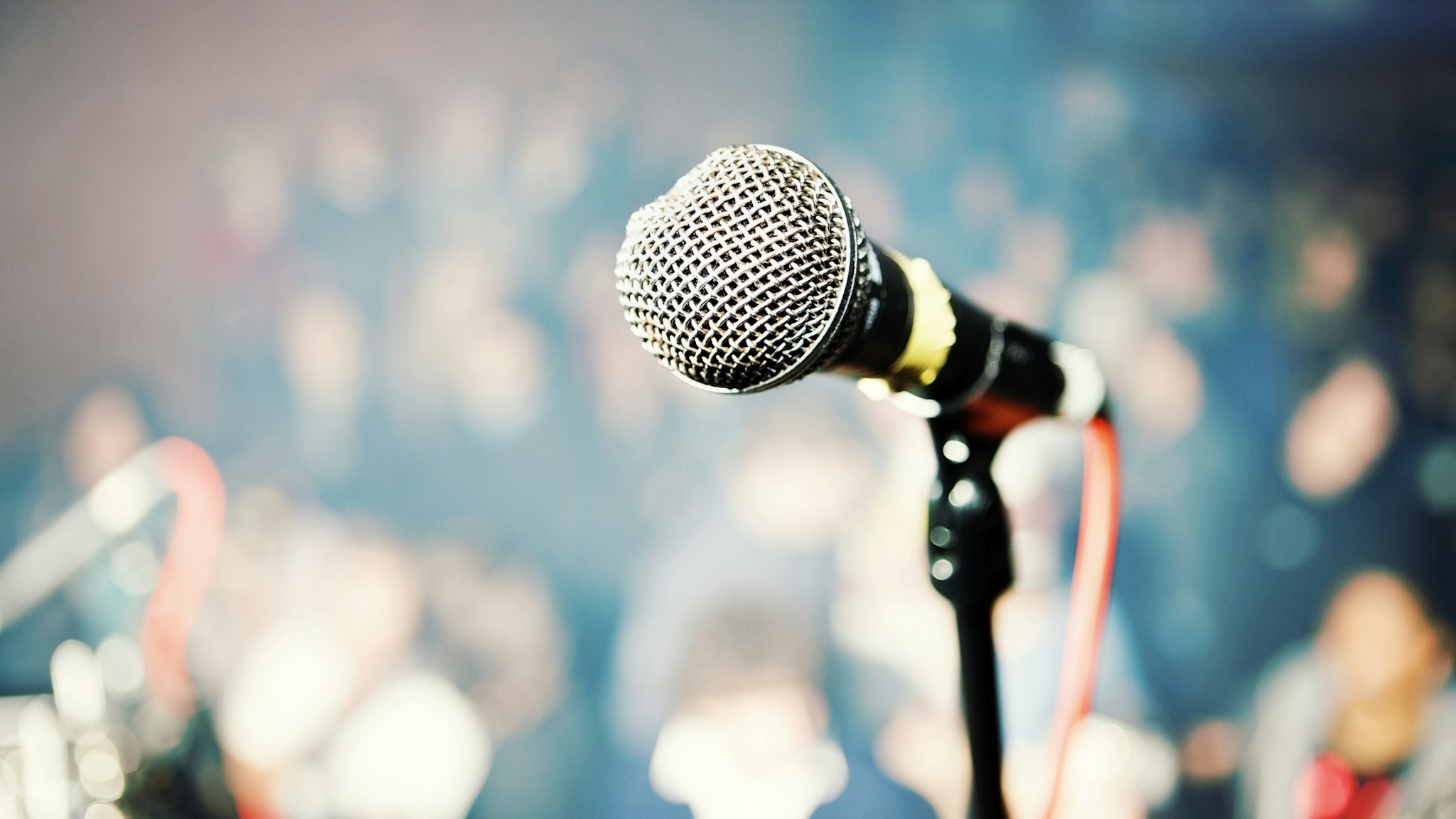 Performer's point of view over microphone into theater audience - stock photo