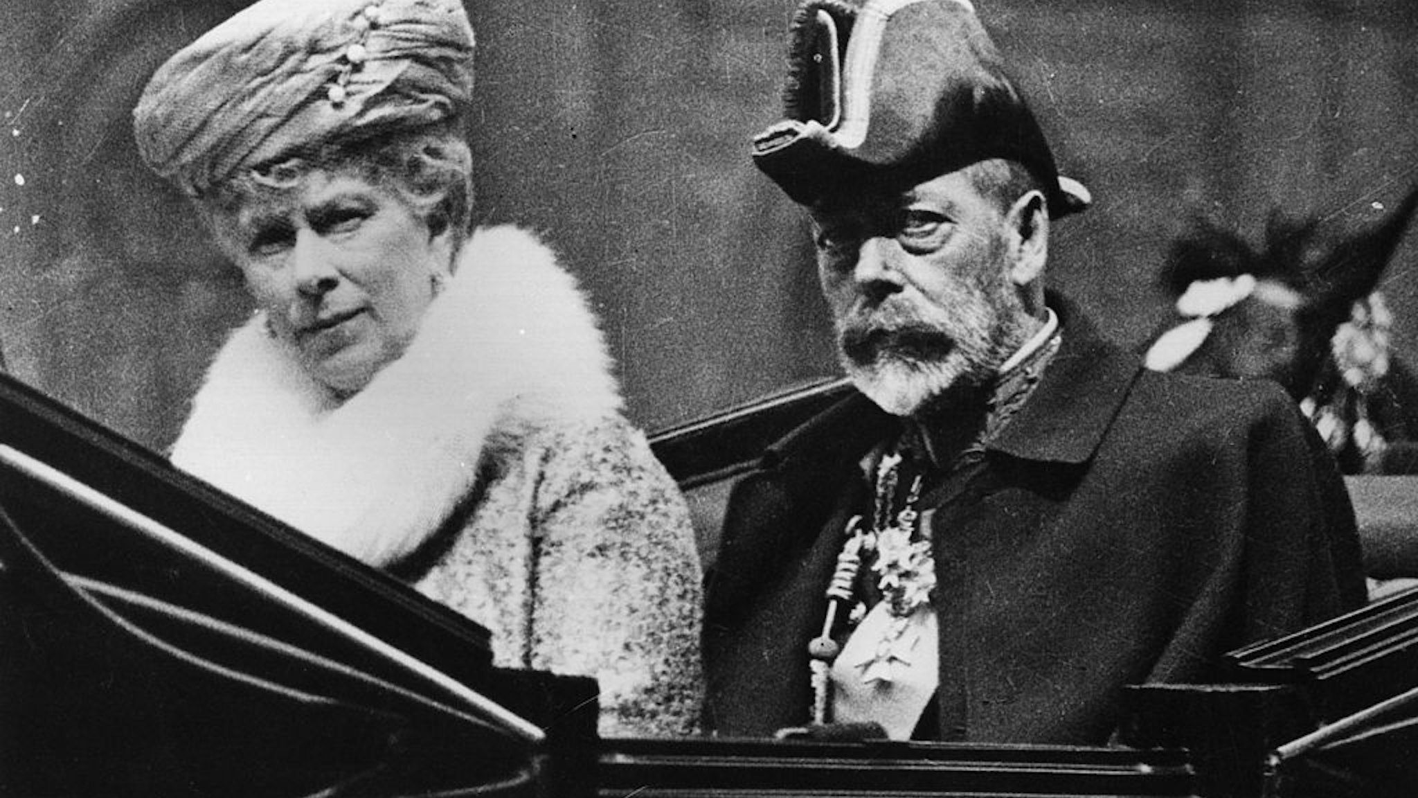 May 1928: A close-up of King George V and Queen Mary in a carriage on their way to the Knights of St John Ceremony at Westminster Abbey. (Photo by Fox Photos/Getty Images)