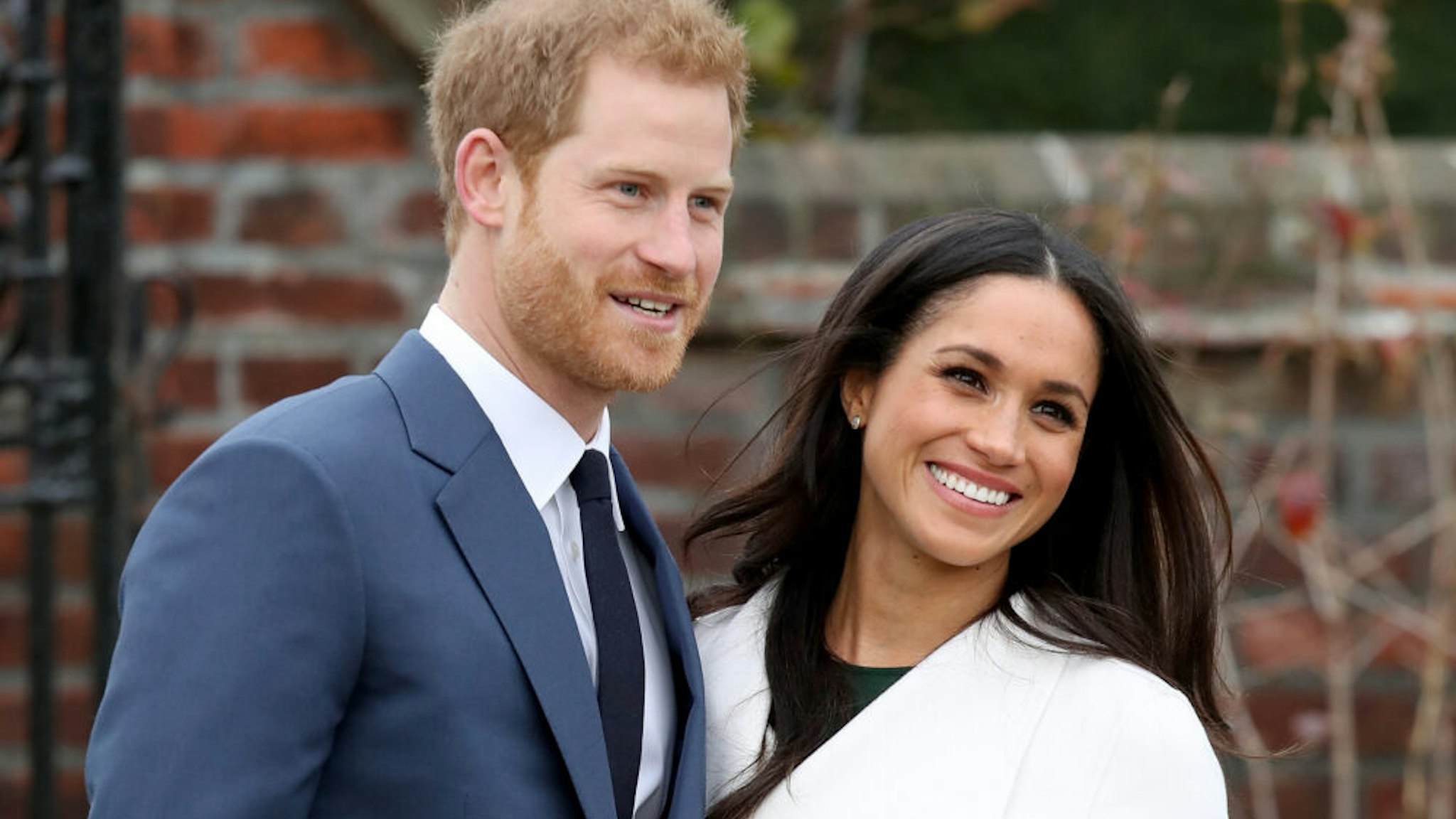 LONDON, ENGLAND - NOVEMBER 27: Prince Harry and actress Meghan Markle during an official photocall to announce their engagement at The Sunken Gardens at Kensington Palace on November 27, 2017 in London, England. Prince Harry and Meghan Markle have been a couple officially since November 2016 and are due to marry in Spring 2018.
