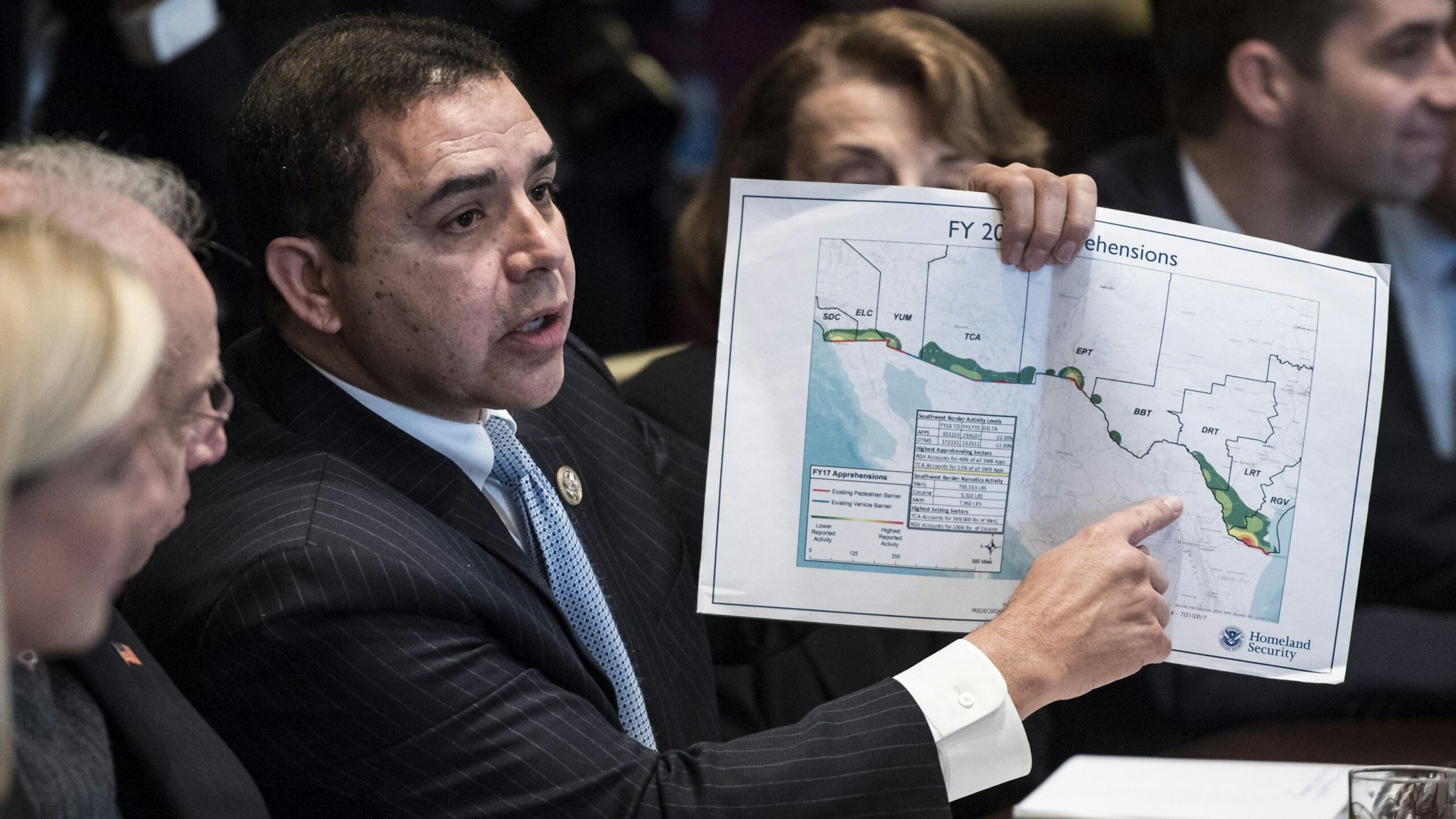 WASHINGTON, DC - JANUARY 9: Rep. Henry Cuellar, D-Texas, hold up a border map as he speaks during a meeting with lawmakers on immigration policy in the Cabinet Room at the White House in Washington, DC on Tuesday, Jan. 09, 2018.