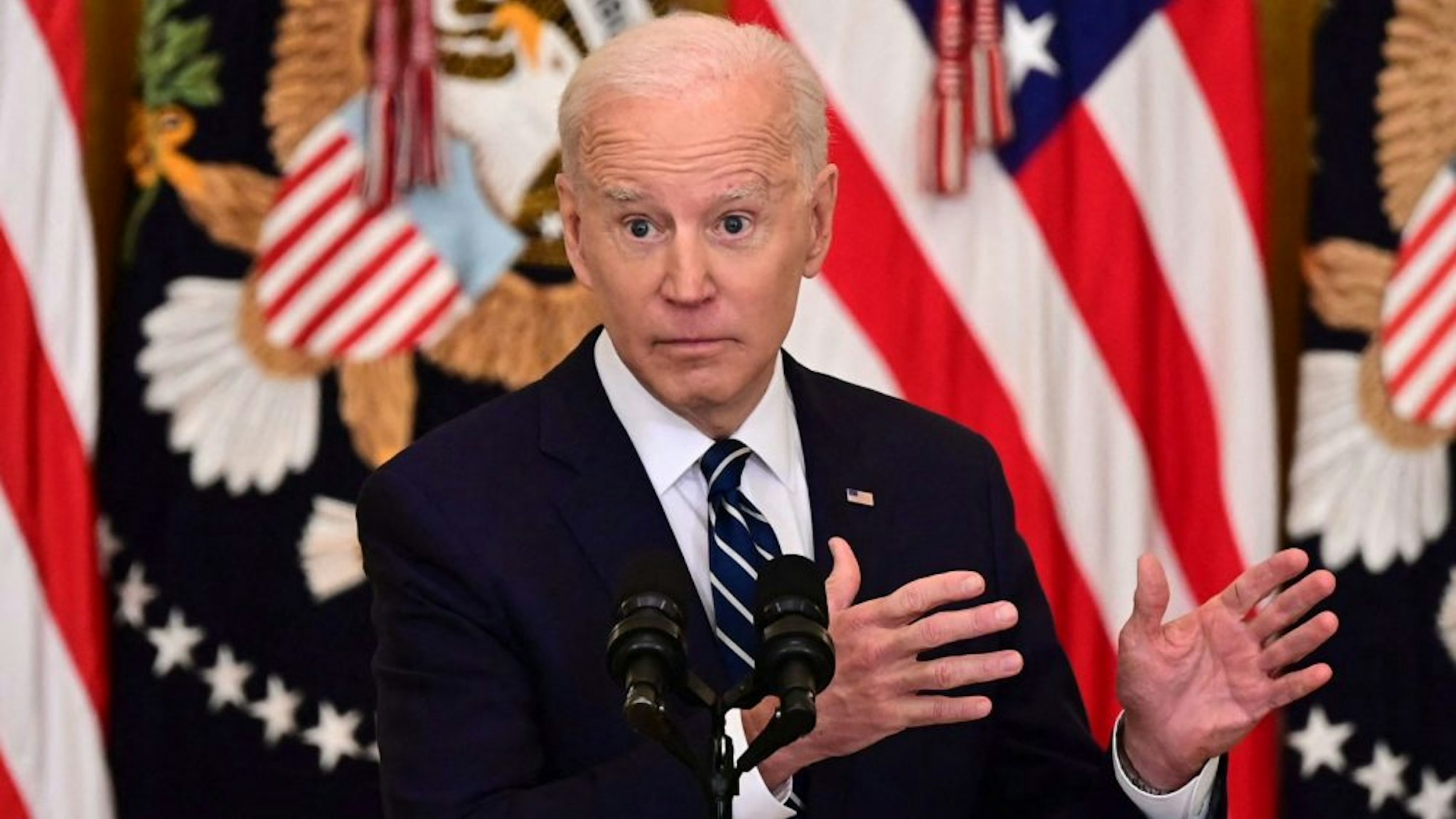 US President Joe Biden answers a question during his first press briefing in the East Room of the White House in Washington, DC, on March 25, 2021. - Biden said Thursday that the United States will "respond accordingly" if North Korea escalates its missile testing.