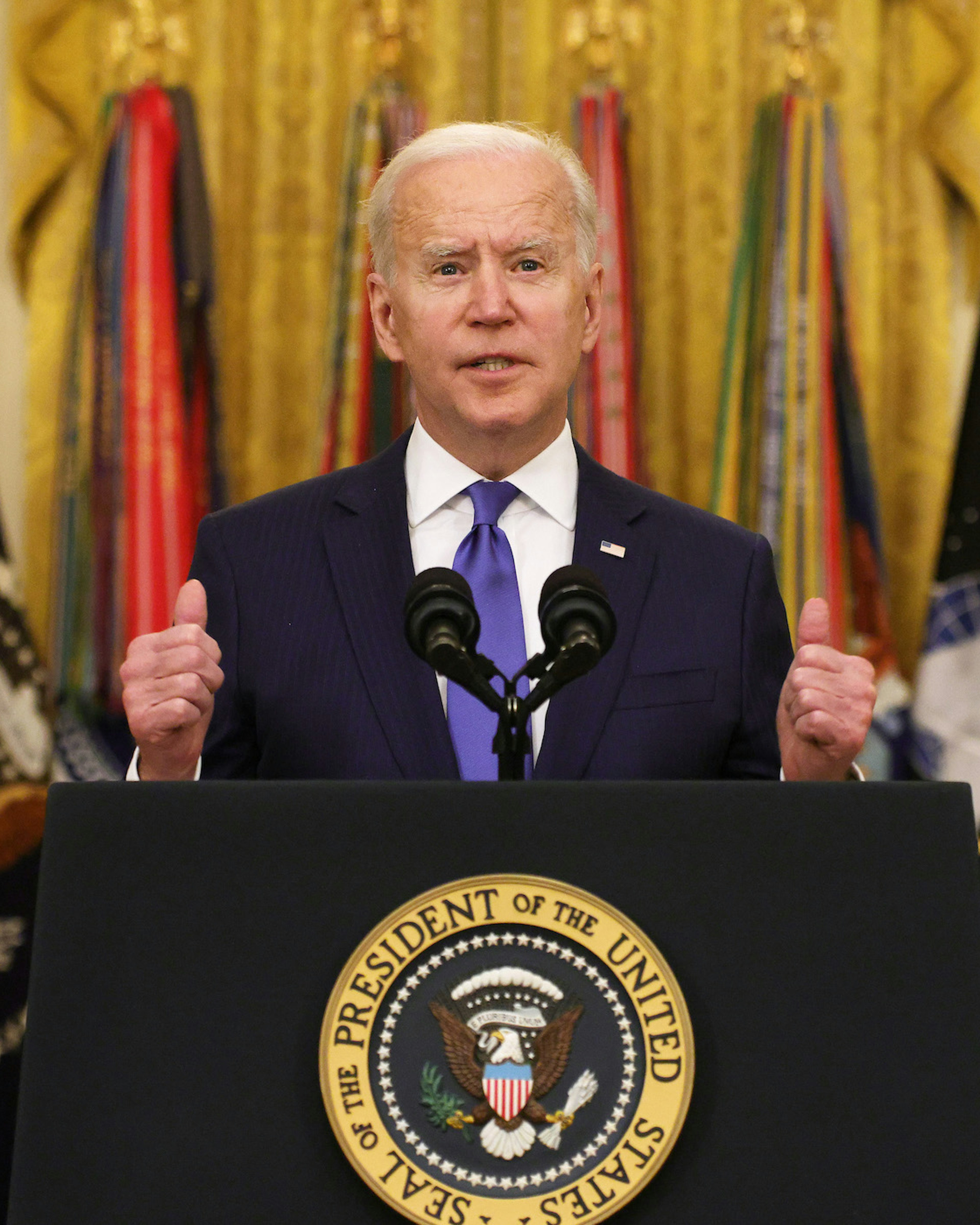 U.S. President Joe Biden delivers remarks on International Women’s Day as Air Force General Jacqueline Van Ovost (L) and Army Lieutenant General Laura Richardson (R) listen during an announcement at the East Room of the White House March 8, 2021 in Washington, DC. President Biden announced the nominations of General Van Ovost and Lieutenant General Richardson to positions as 4-star combatant commanders. They will become the second and the third women to lead a combatant command in American history. (Photo by Alex Wong/Getty Images)