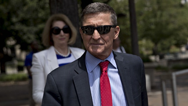 Michael Flynn, former U.S. national security adviser, exits federal court in Washington, D.C., U.S., on Monday, June 24, 2019. Flynn may have a singular goal in replacing his longtime criminal defense attorneys this month with the politically provocative Sidney Powell, to win a pardon from his old boss, President Donald Trump. Photographer: Andrew Harrer/Bloomberg
