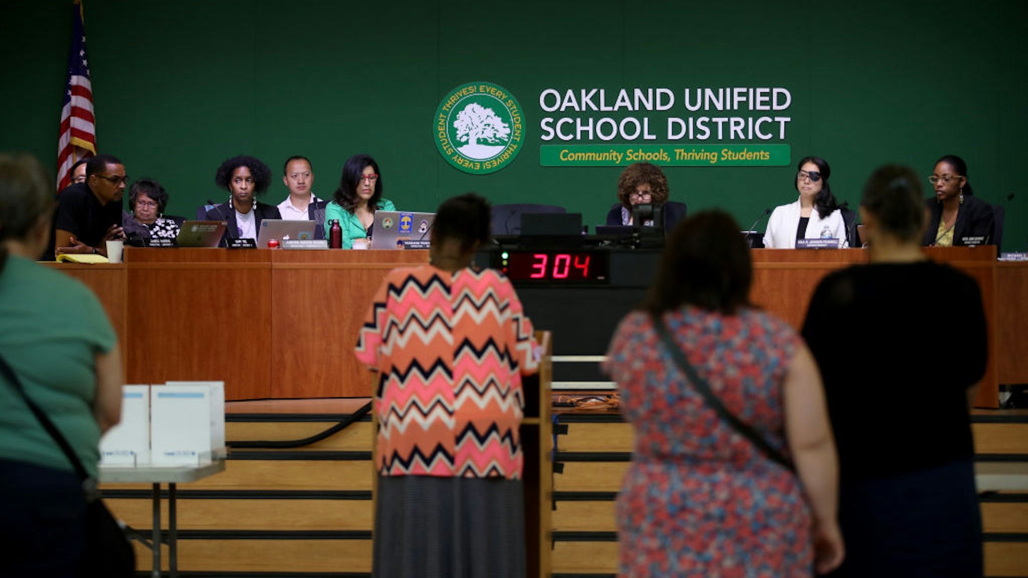 Jumoke Hinton Hodge (fourth from left), an Oakland Unified School District board member, attends a meeting in the Great Room at the LaEscuelita Center in Oakland, Calif., on Wednesday, June 12, 2019. Darnisha Wright, a kindergarten teacher at Markham Elementary in East Oakland, was choked by Hodge during the teacher's strike in March, an altercation that was caught on video, which went viral. In April, less than a month after the incident and shortly after Wright said she would file charges, she received a letter from the principal of her school that terminated her employment.