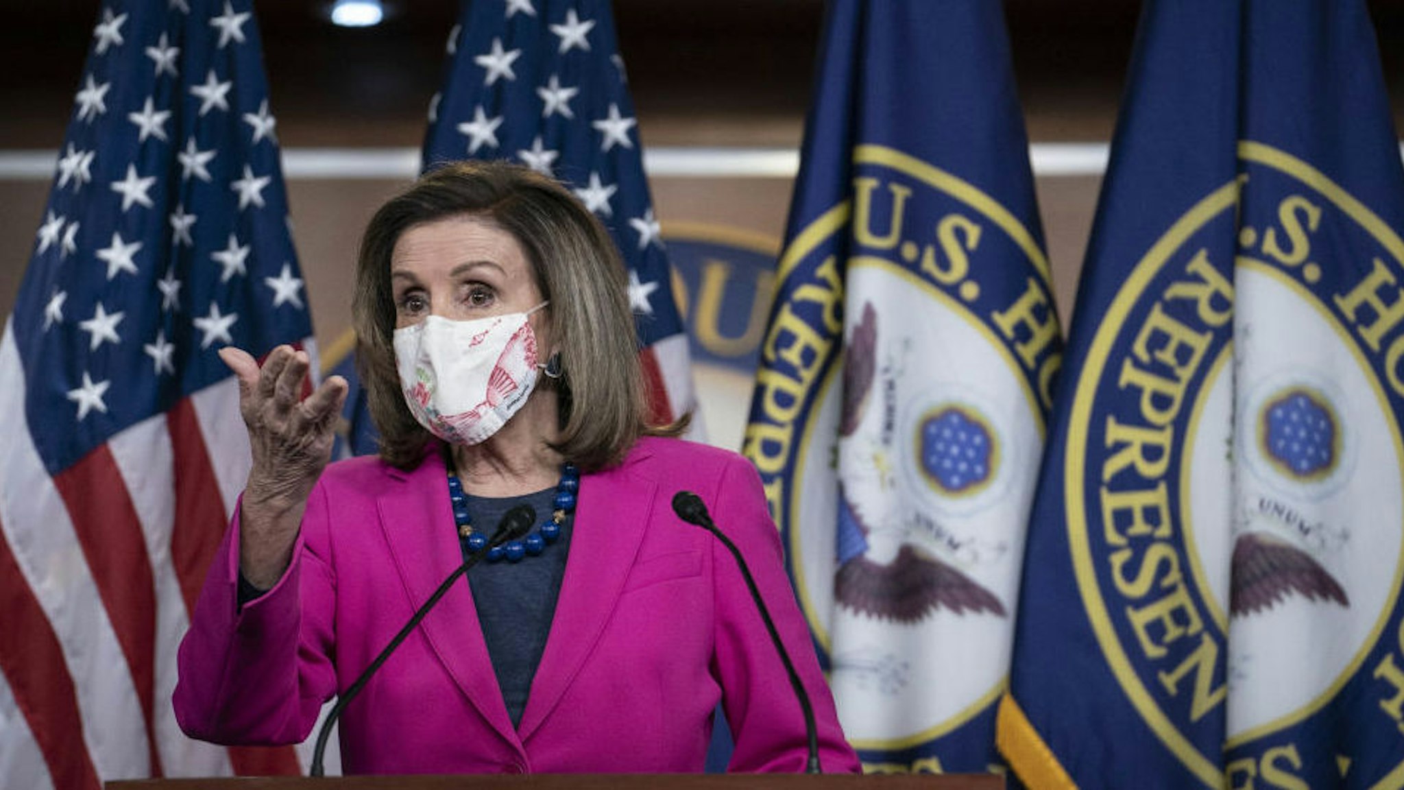 U.S. House Speaker Nancy Pelosi, a Democrat from California, wears a protective mask while speaking during a news conference at the U.S. Capitol in Washington, D.C., U.S., on Thursday, Feb. 25, 2021. House Democrats released an updated version of their coronavirus stimulus bill Wednesday, adding funds for foreign aid, tribal governments and housing, and other measures ahead of a vote later this week.