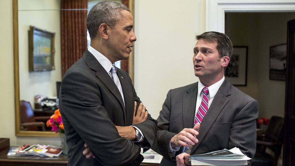 President Barack Obama speaks with Dr. Ronny Jackson in the Outer Oval Office, Feb. 21, 2014.