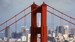 San Francisco Will Study Golden Gate Tidal Movement As Energy Source SAUSALITO, CA - JUNE 20: The Transamerica Pyramid building is seen through the north tower of the Golden Gate Bridge June 20, 2007 as seen from Sausalito, California. Pacific Gas and Electric has launched an estimated $1.5 million research program to study the possibility of submerging turbines under the water to gather energy from tidal flows. A previous study conducted by the Electric Power Research Institute in 2006 came to conclude that the tides that pass under the iconic Golden Gate bridge are the best on the West Coast of the U.S. to generate power.