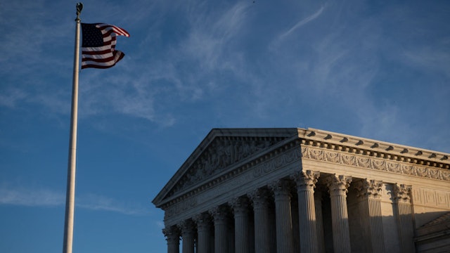 An American flag flies outside of the U.S. Supreme Court in Washington, D.C.