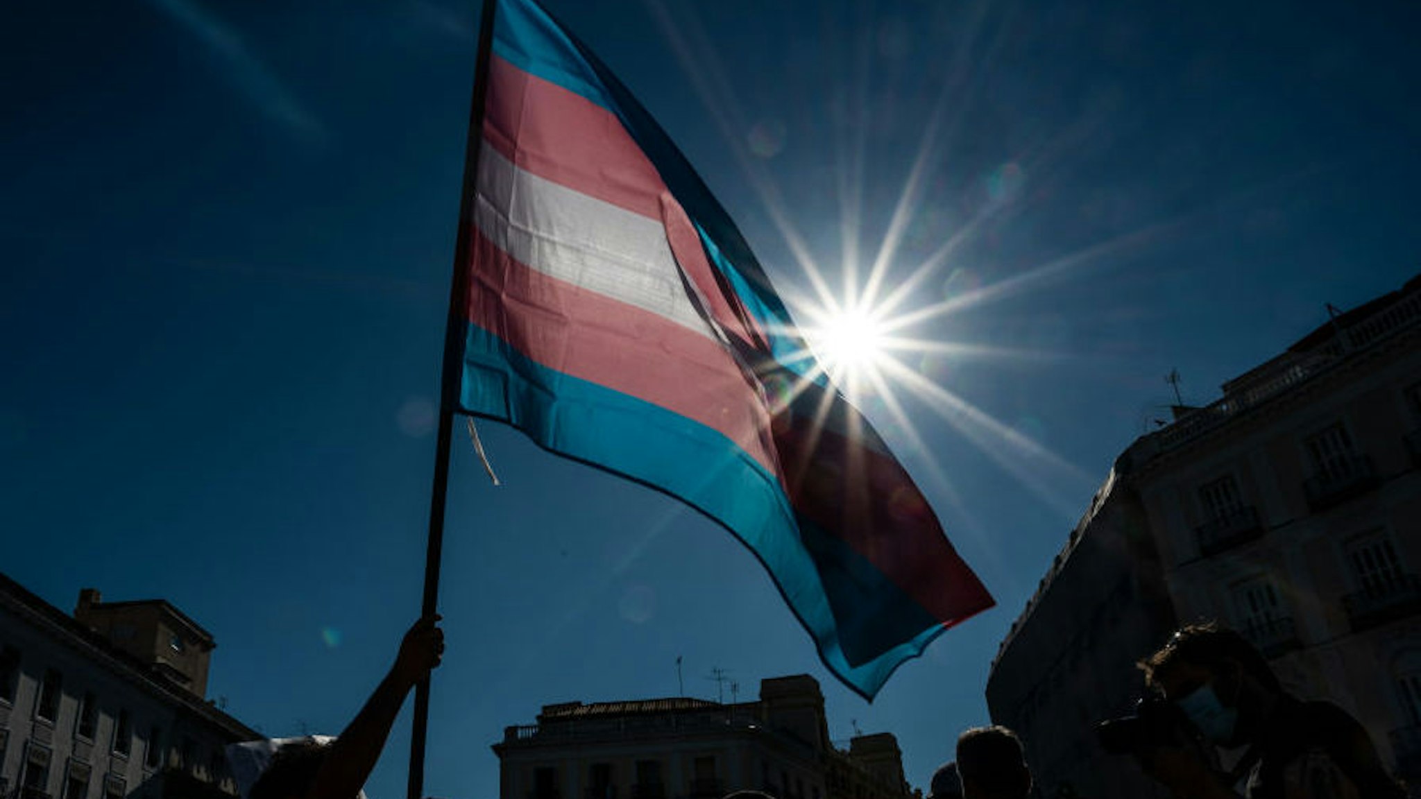 Demonstrator waving the Trans flag attends a protest where Trans community demand a state law that will guarantee gender self-determination. The protest coincides with the Pride celebrations that are taking place this week. (Photo by Marcos del Mazo/LightRocket via Getty Images)