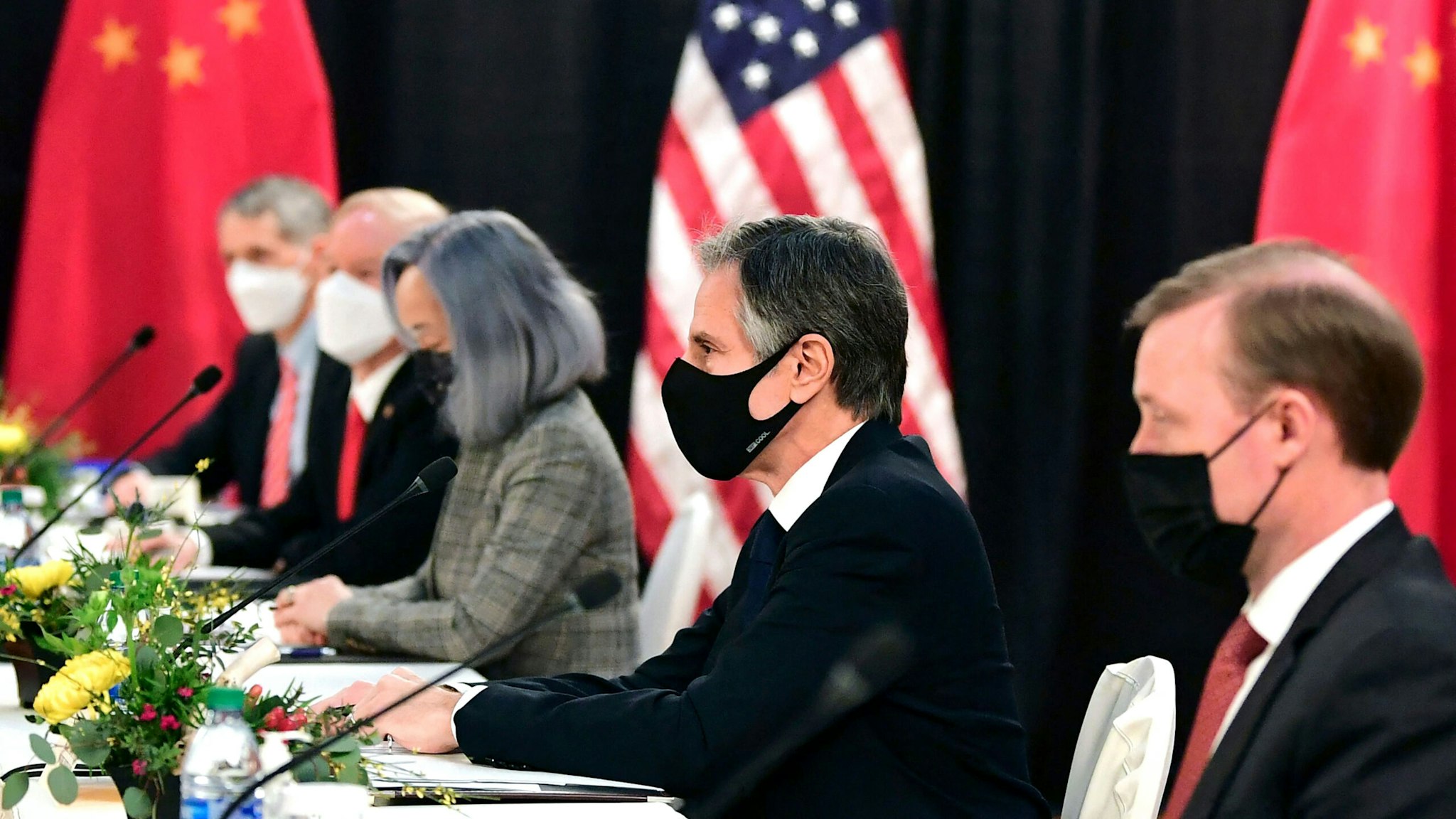 The US delegation led by Secretary of State Antony Blinken (C), flanked by US National Security Advisor Jake Sullivan (R), face their Chinese counterparts at the opening session of US-China talks at the Captain Cook Hotel in Anchorage, Alaska on March 18, 2021. - China's actions "threaten the rules-based order that maintains global stability," US Secretary of State Antony Blinken said Thursday at the opening of a two-day meeting with Chinese counterparts in Alaska.