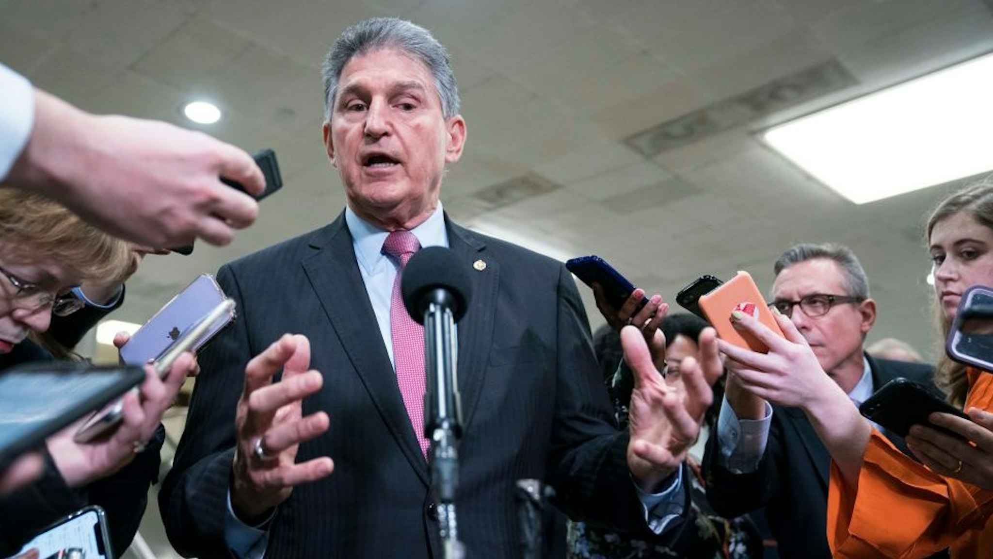 WASHINGTON, DC - FEBRUARY 05: Senator Joe Manchin (D-WV) speaks to the press near the Senate subway following a vote in the Senate impeachment trial that acquitted President Donald Trump of all charges on February 5, 2020 in Washington, DC. After the House impeached Trump last year, the Senate voted today to acquit the President on two articles of impeachment as the trial concludes. (Photo by
