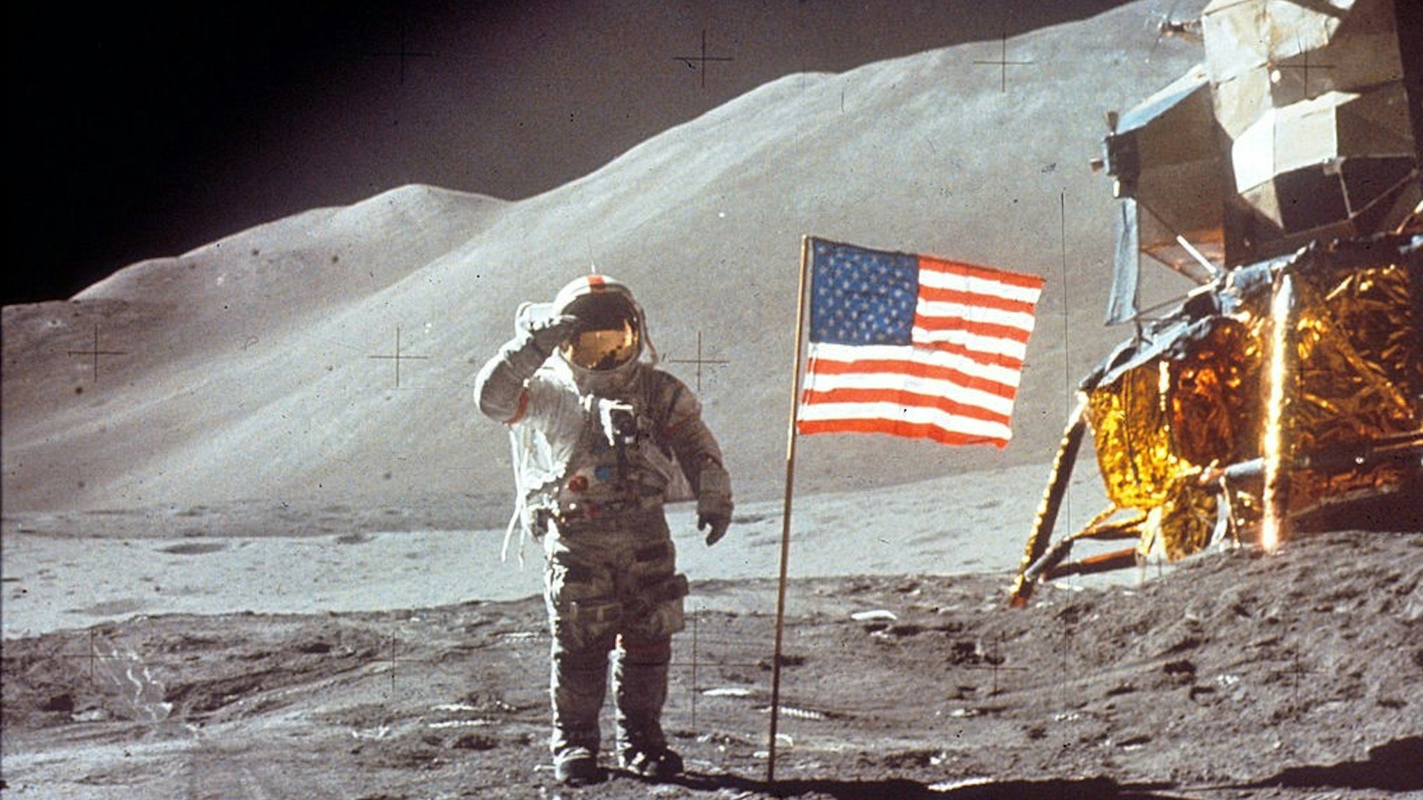 060280 01: Astronaut David Scott gives salute beside the U.S. flag July 30, 1971 on the moon during the Apollo 15 mission. (Photo by