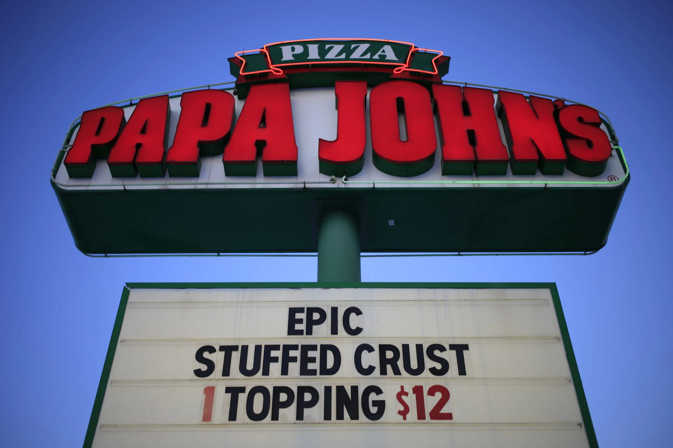 Signage outside a Papa John's International Inc. pizza restaurant in Louisville, Kentucky, U.S., on Monday, Feb. 22, 2021.