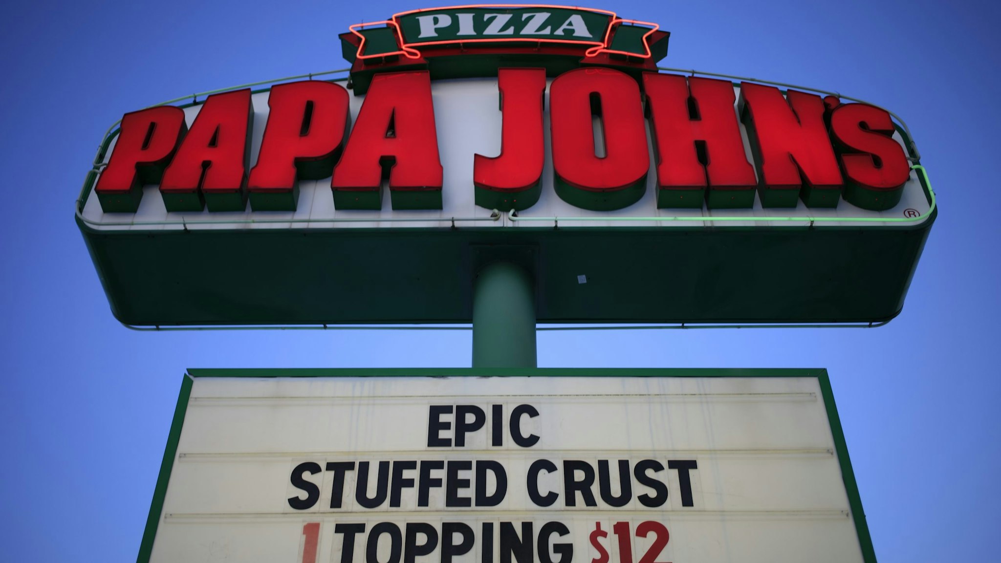 Signage outside a Papa John's International Inc. pizza restaurant in Louisville, Kentucky, U.S., on Monday, Feb. 22, 2021.