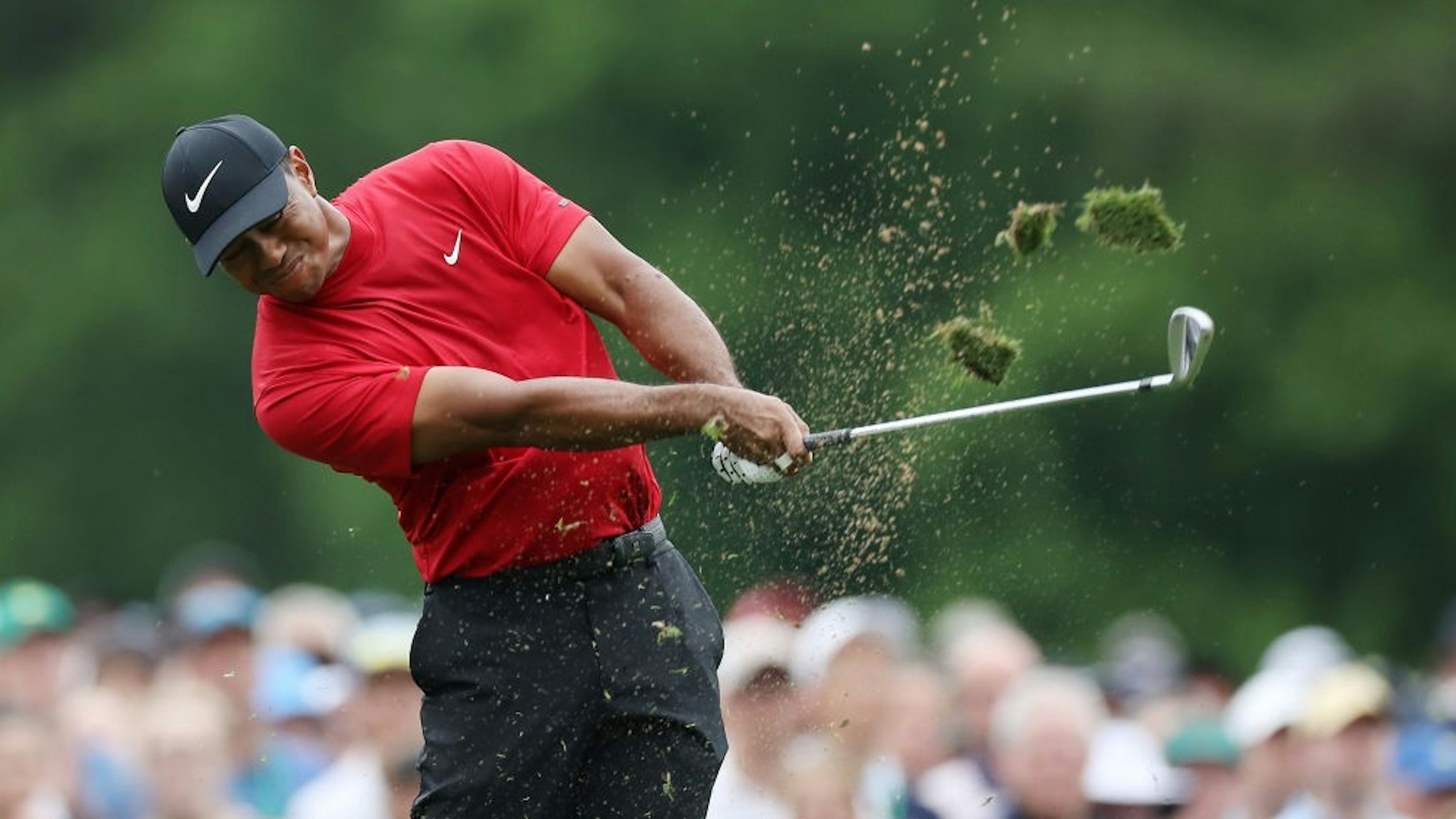 AUGUSTA, GEORGIA - APRIL 14: Tiger Woods of the United States plays a shot from the 12th tee during the final round of the Masters at Augusta National Golf Club on April 14, 2019 in Augusta, Georgia. (Photo by