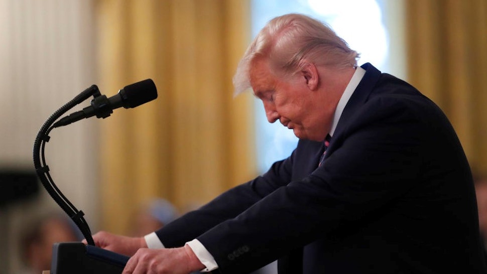 U.S. President Donald Trump pauses while speaking during an event at the White House in Washington, D.C., U.S., on Thursday, Feb. 6, 2020. Trump's acquittal by the Senate delivered an expected yet exhilarating victory to the White House, freeing a president who has for years operated under the threat of impeachment and longed for vindication. Photographer:
