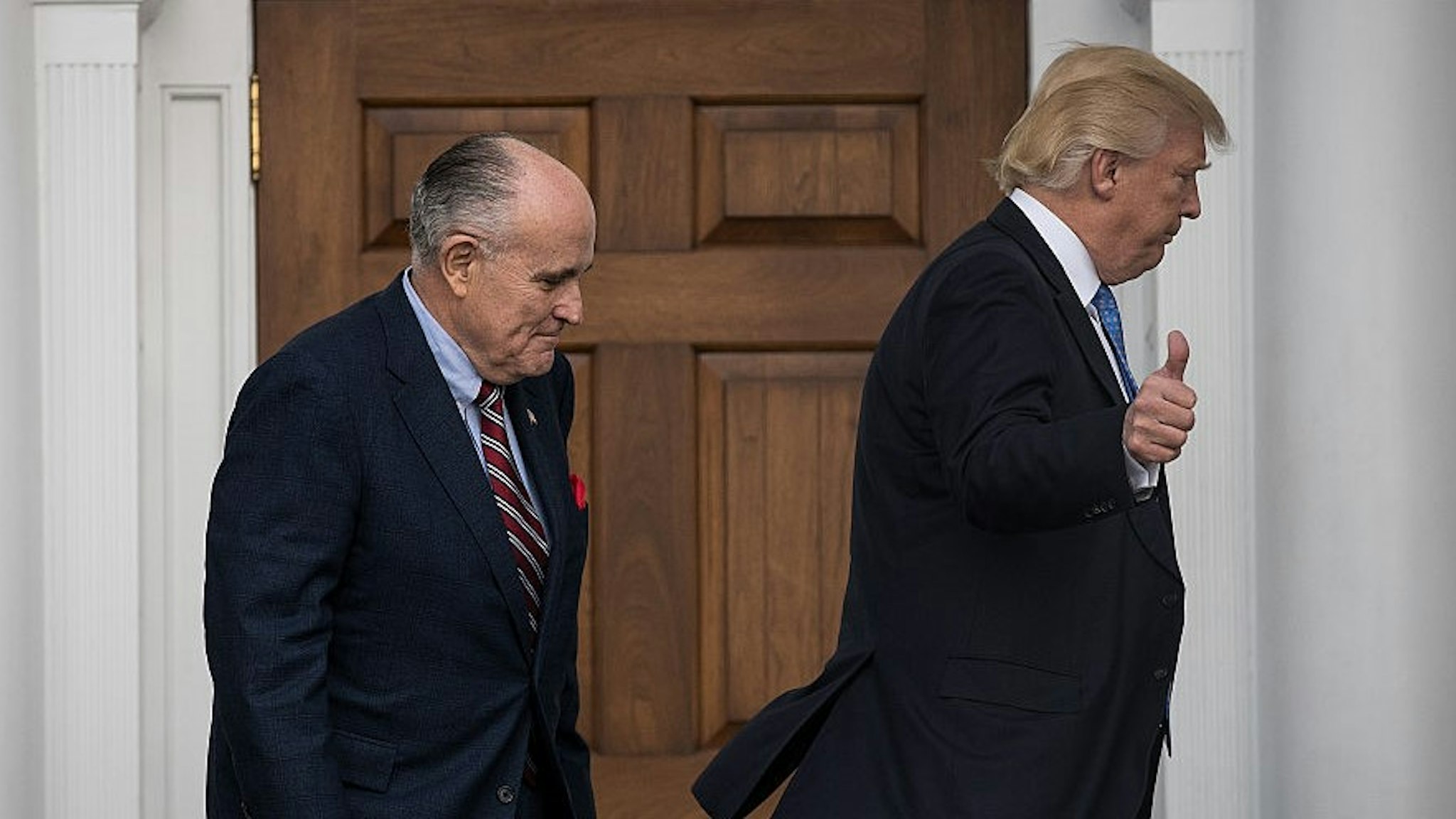 BEDMINSTER TOWNSHIP, NJ - NOVEMBER 20: (L to R) Former New York City mayor Rudy Giuliani and president-elect Donald Trump head into the clubhouse for their meeting at Trump International Golf Club, November 20, 2016 in Bedminster Township, New Jersey. Trump and his transition team are in the process of filling cabinet and other high level positions for the new administration. (Photo by
