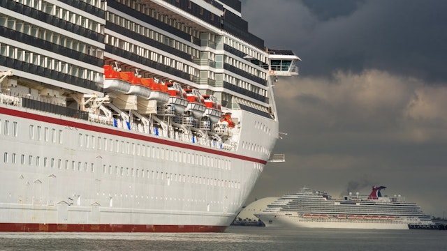 The Carnival Corp. Miracle and Panorama cruise ships sit acnhored at the Port of Long Beach in Long Beach, California, U.S., on Monday, April 13, 2020. The Centers for Disease Control and Prevention extended its “No Sail Order” for all cruise ships by at least 100 days -- or until Covid-19 is no longer considered a public health emergency. Photographer: Tim Rue/Bloomberg