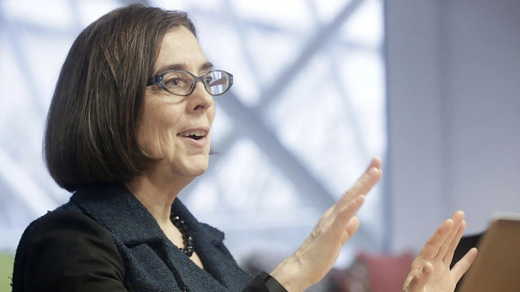 Oregon Governor Kate Brown Interview Kate Brown, governor of Oregon, speaks during an interview in Portland, Oregon, U.S. on Wednesday, Jan. 20, 2016. Brown, a Democrat, joined the state House of Representatives in 1991, was later elected to the Senate and served as secretary of state since 2009, before taking over as governor in February. Photographer: Meg Roussos/Bloomberg via Getty Images