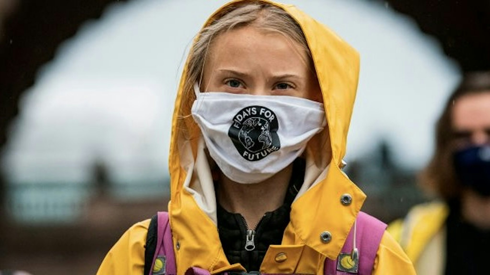 TOPSHOT - Swedish climate activist Greta Thunberg protests during a "Fridays for Future" protest in front of the Swedish Parliament Riksdagen in Stockholm on October 9, 2020. (Photo by Jonathan NACKSTRAND / AFP) (Photo by JONATHAN NACKSTRAND/AFP via Getty Images)