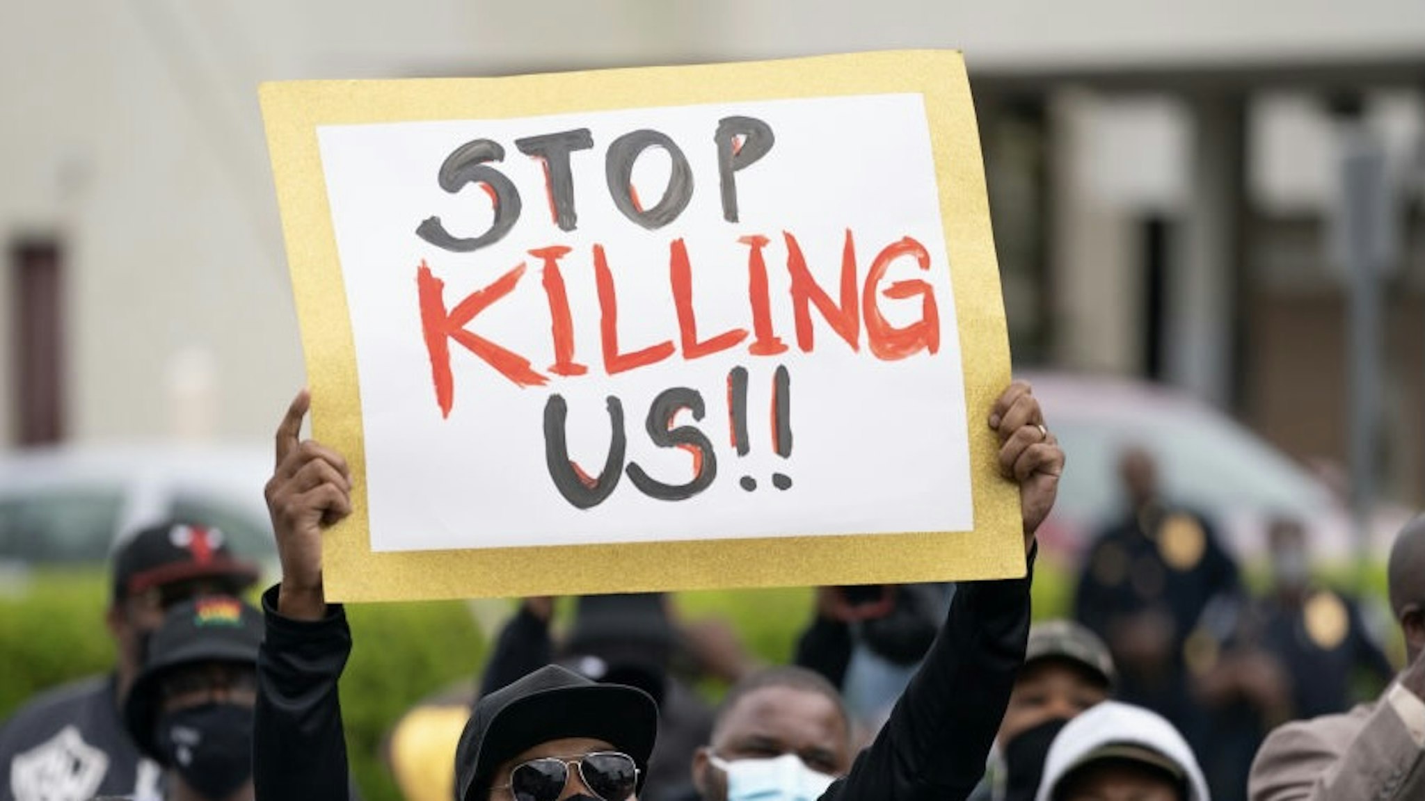 ELIZABETH CITY, NC - APRIL 23: Demonstrators gather outside a government building during an emergency city council meeting April 23, 2021 in Elizabeth City, North Carolina. Protestors gathered as elected officials discussed the possible release of police body camera footage from the shooting death of Andrew Brown Jr. on April 21. (Photo by Sean Rayford/Getty Images)