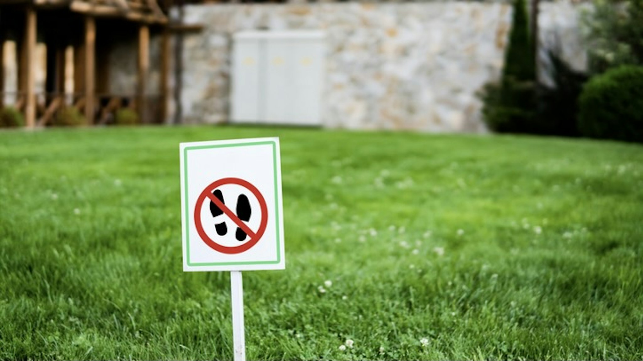 No Walking Sign in a Park Grass Lawn - stock photo No Walking Sign in a Park Grass Lawn