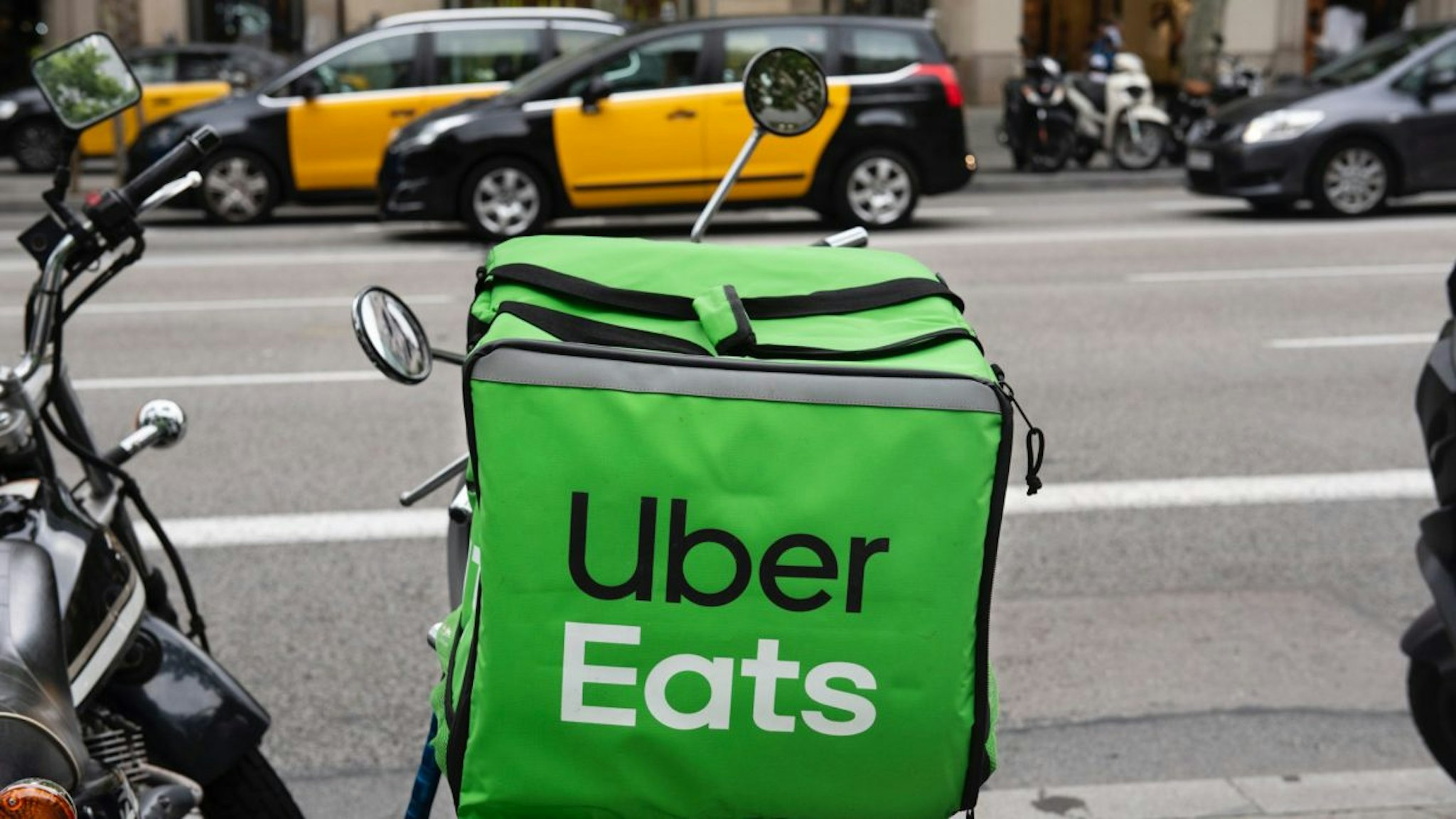American online food ordering and delivery platform launched by Uber, Uber Eats, logo on a bicycle in Barcelona.