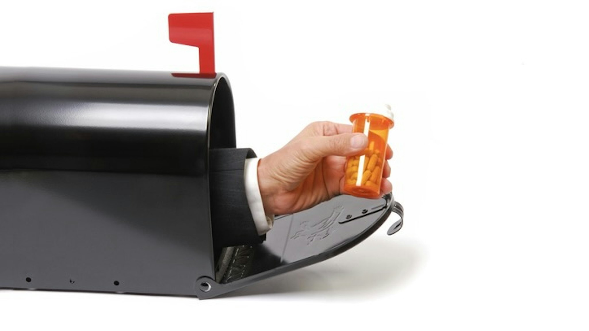 Mailbox Prescription - stock photo Mailbox with business man holding prescription bottle.