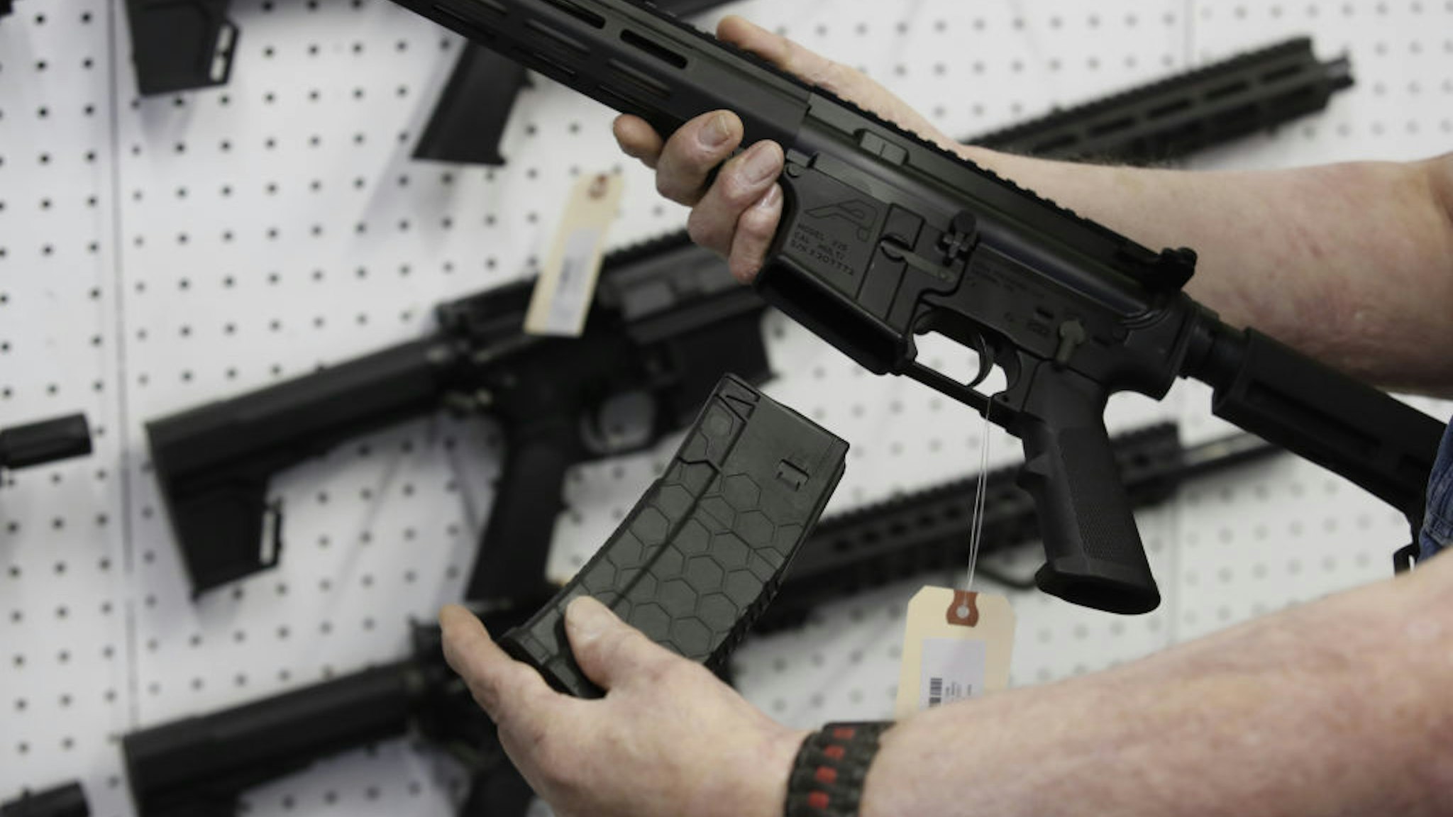 A salesperson holds a high capacity magazine for an AR-15 rifle at a store in Orem, Utah, U.S., on Thursday, March 25, 2021. Two mass shootings in one week are giving Democrats new urgency to pass gun control legislation, but opposition from Republicans in the Senate remains the biggest obstacle to any breakthrough in the long-stalled debate. Photographer: George Frey/Bloomberg